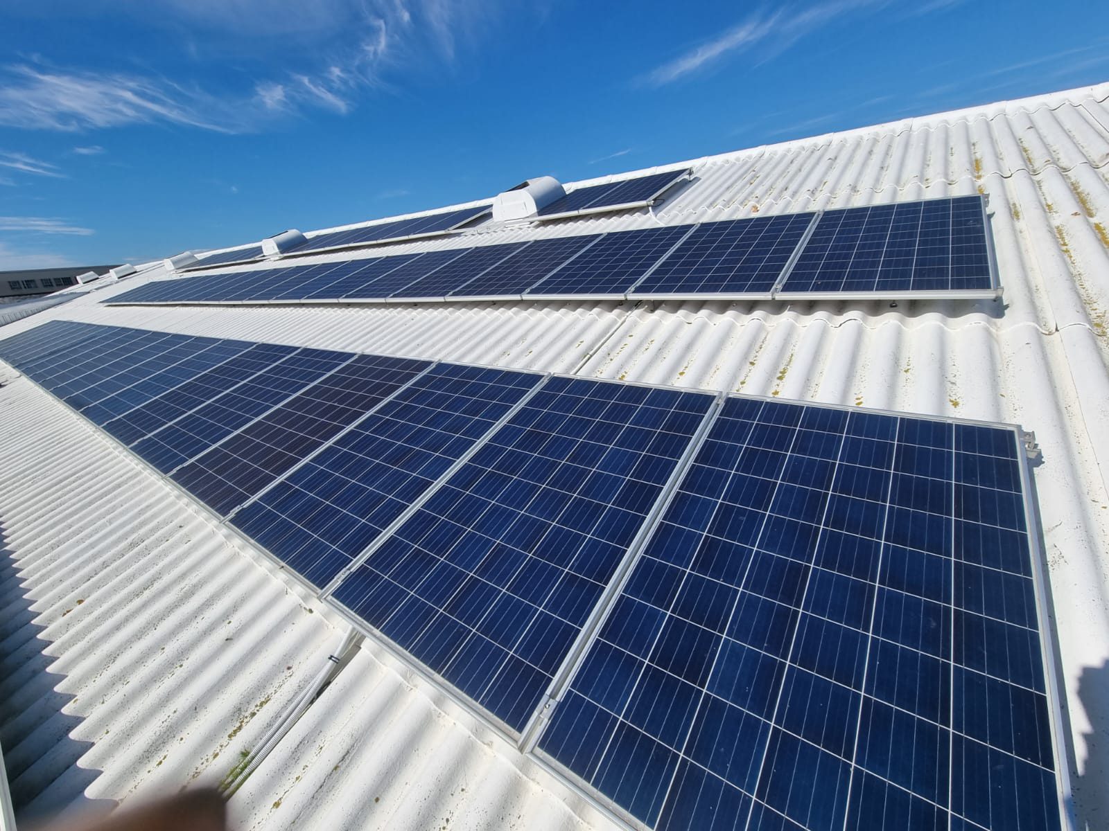 Commercial solar array installed on an industrial roof